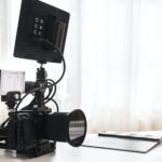 Modern black mirrorless camera rig and clapperboard